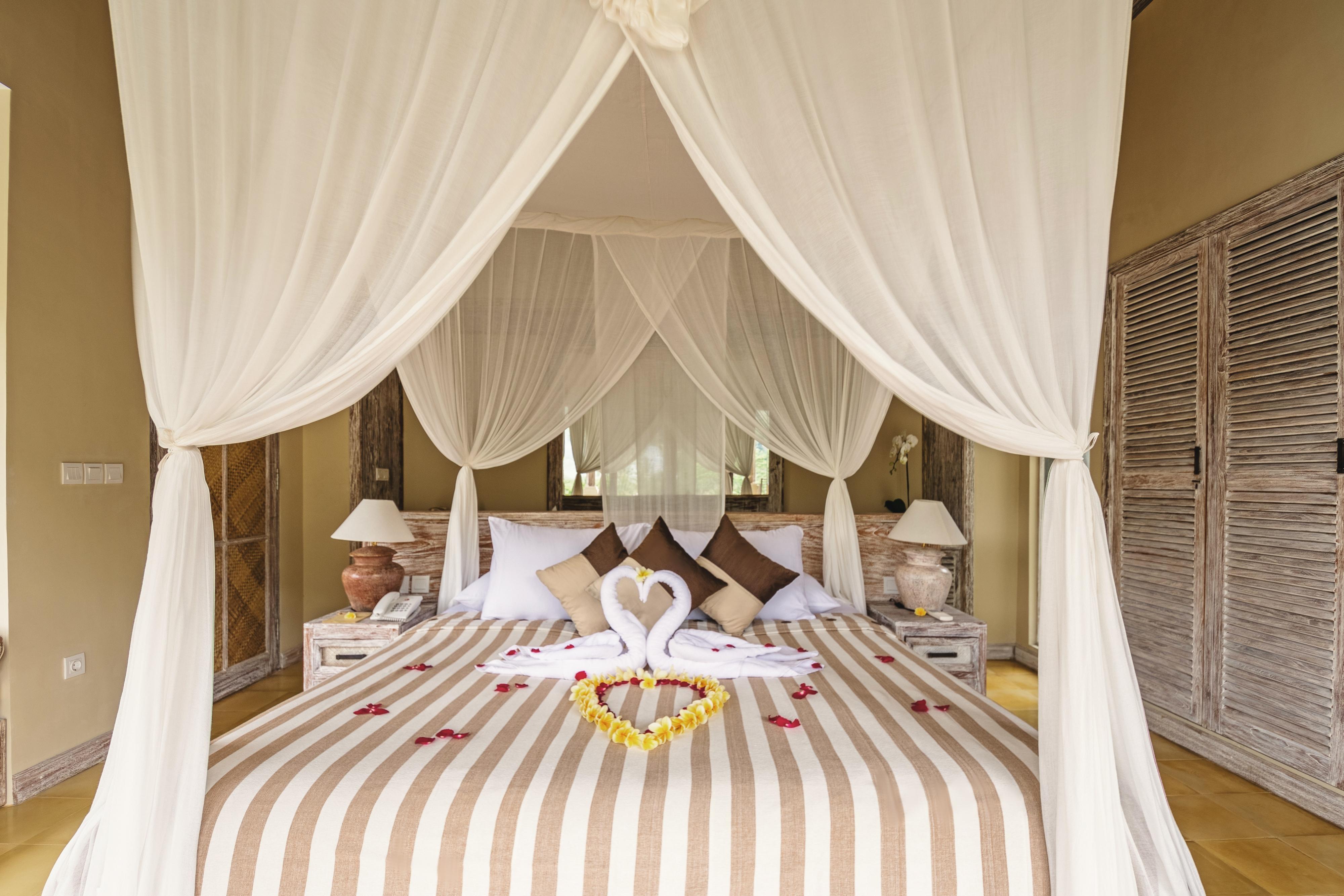 Отель Wapa Di Ume Sidemen Сидемен Экстерьер фото A bed with a mosquito net